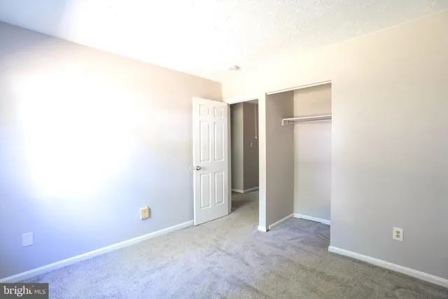 a view of a room that has a grey walls