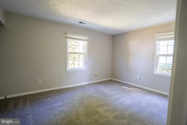 a view of hallway with closet