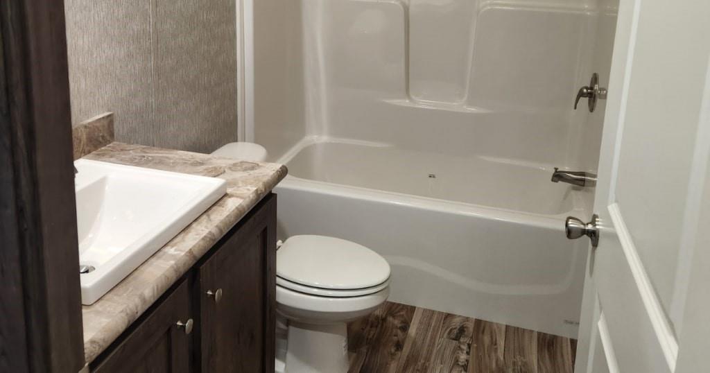 1302 Hidden Valley Road Bulger, PA 15019 - Photo 8 of 19 a bathroom with a granite countertop sink toilet and shower