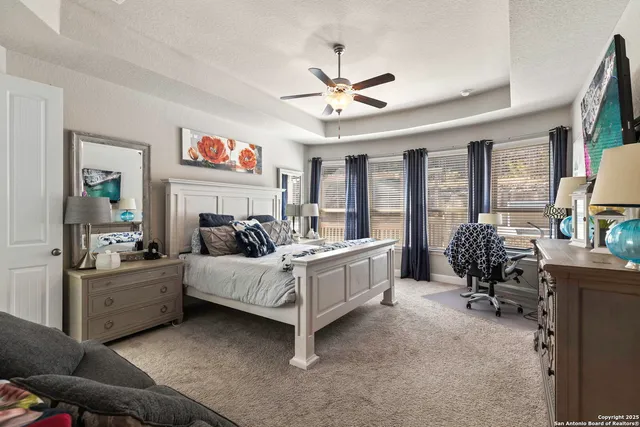 a bed room with furniture and a chandelier