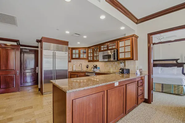a kitchen with a stove a refrigerator and a sink