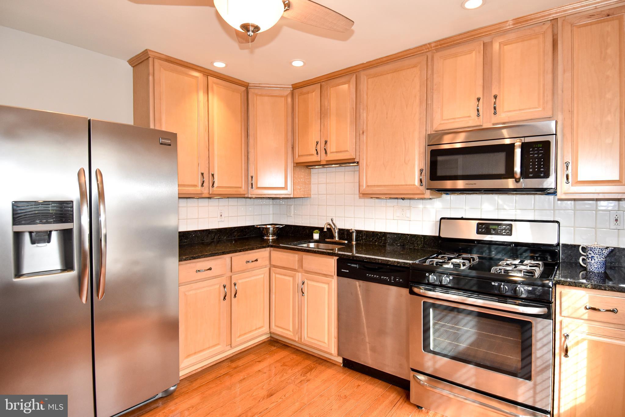 2412 Alsop Court Reston, VA 20191 - Photo 15 of 44 Granite countertops and stainless steel appliances