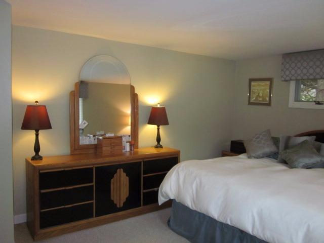 110 Guildford Road Centerville, MA 02632 - Photo 16 of 25 a bedroom with a bed and a table