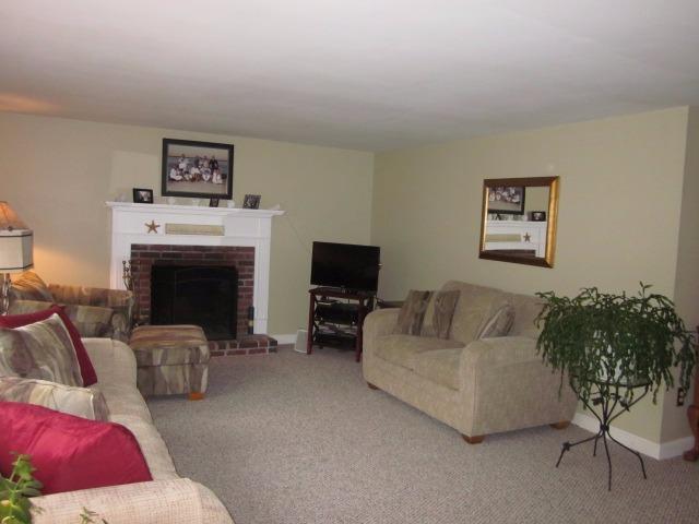 110 Guildford Road Centerville, MA 02632 - Photo 5 of 25 a living room with furniture and a fireplace