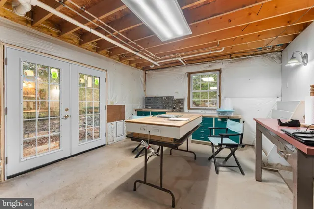 a view of a big house with a big yard and large trees