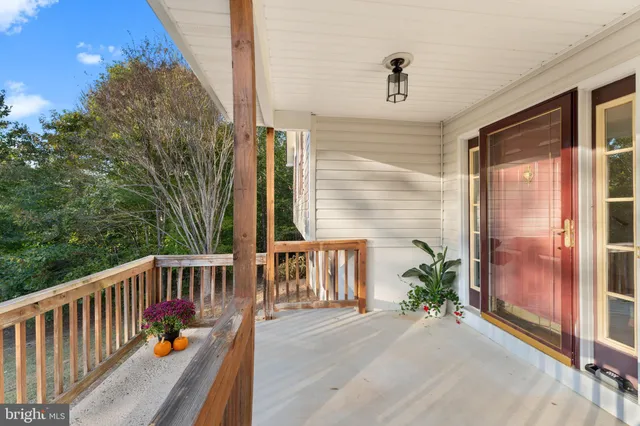 a backyard of a house with fountain and outdoor seating