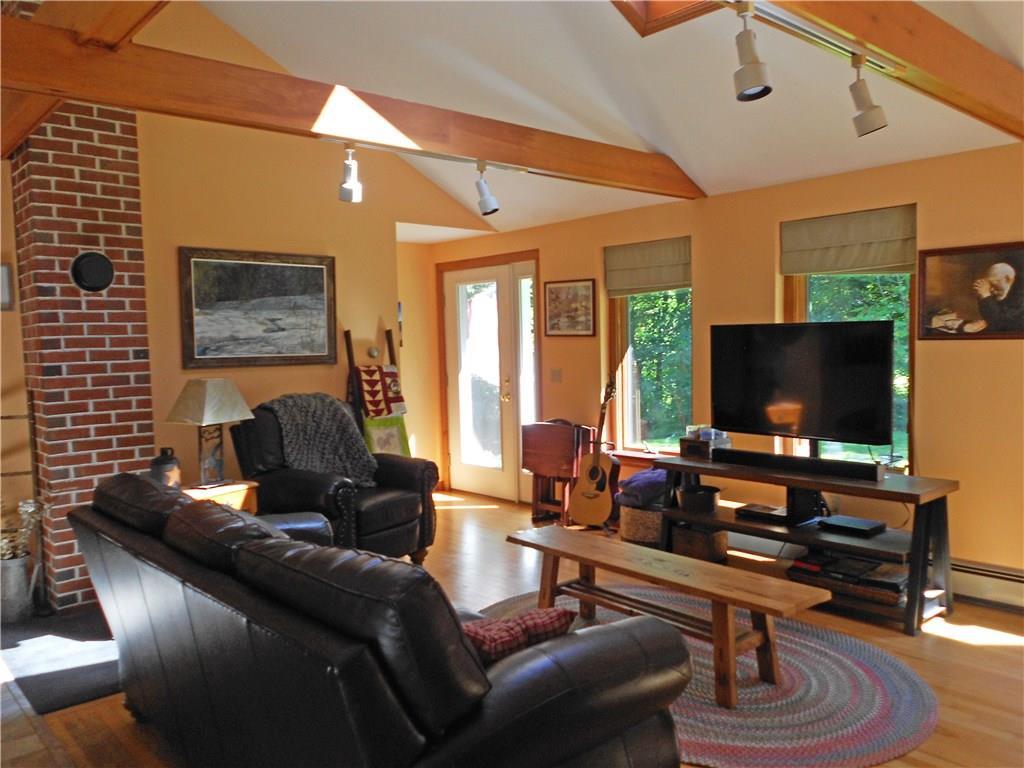 331 Millay Road Bowdoinham, ME 04008 - Photo 20 of 35 The living room has hardwood floors....