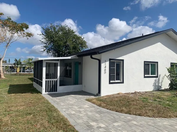 a front view of a house with a yard