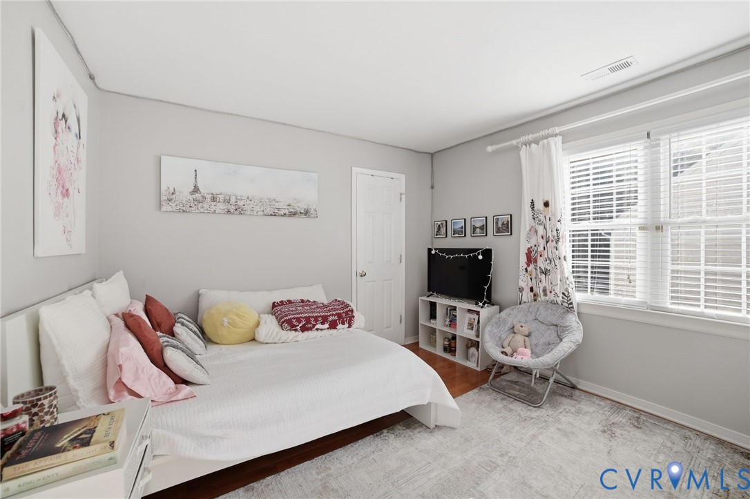 9509 Meadowview Road Henrico, VA 23294 - Photo 22 of 38 a bedroom with a bed and a window