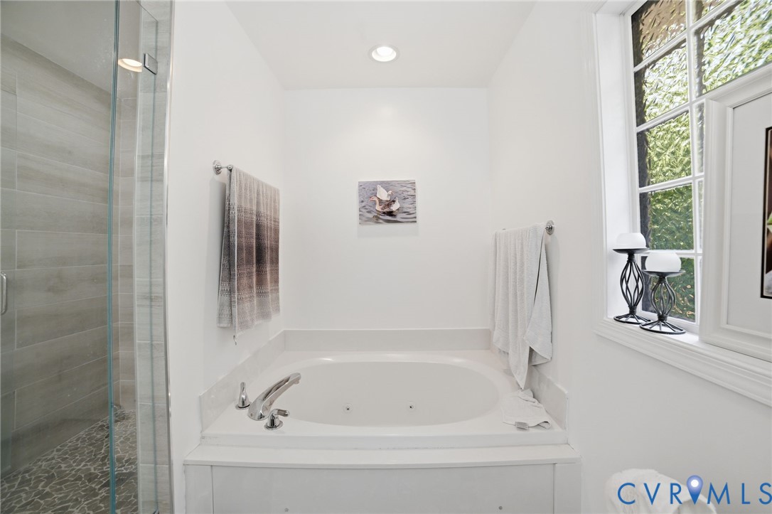 9509 Meadowview Road Henrico, VA 23294 - Photo 26 of 38 a white bath tub sitting next to a window