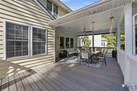 a view of a deck with table and chairs and wooden floor