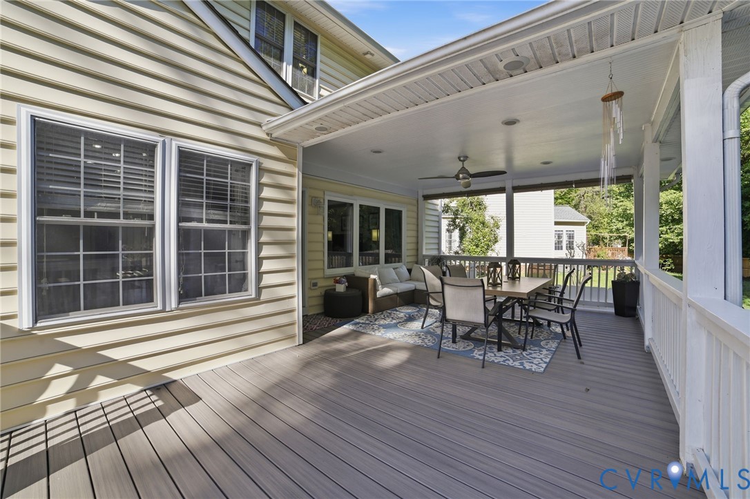 9509 Meadowview Road Henrico, VA 23294 - Photo 27 of 38 a view of a deck with table and chairs and wooden floor