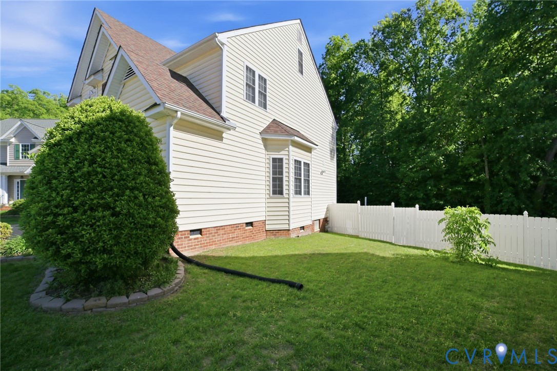 9509 Meadowview Road Henrico, VA 23294 - Photo 30 of 38 a view of a white house with a yard and sitting area