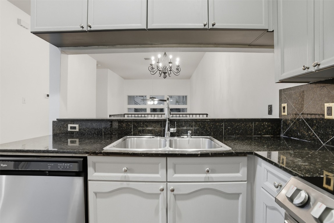 2918 Ranch To Market Road 620, Unit V267 Austin, TX 78734 - Photo 17 of 40 The kitchen has granite countertops, stainless steel appliances including refrigerator, electric stove and overlooks the dining room.