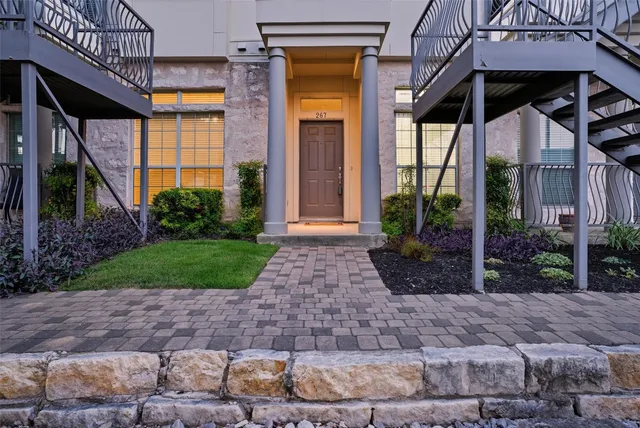 a front view of a house with garden