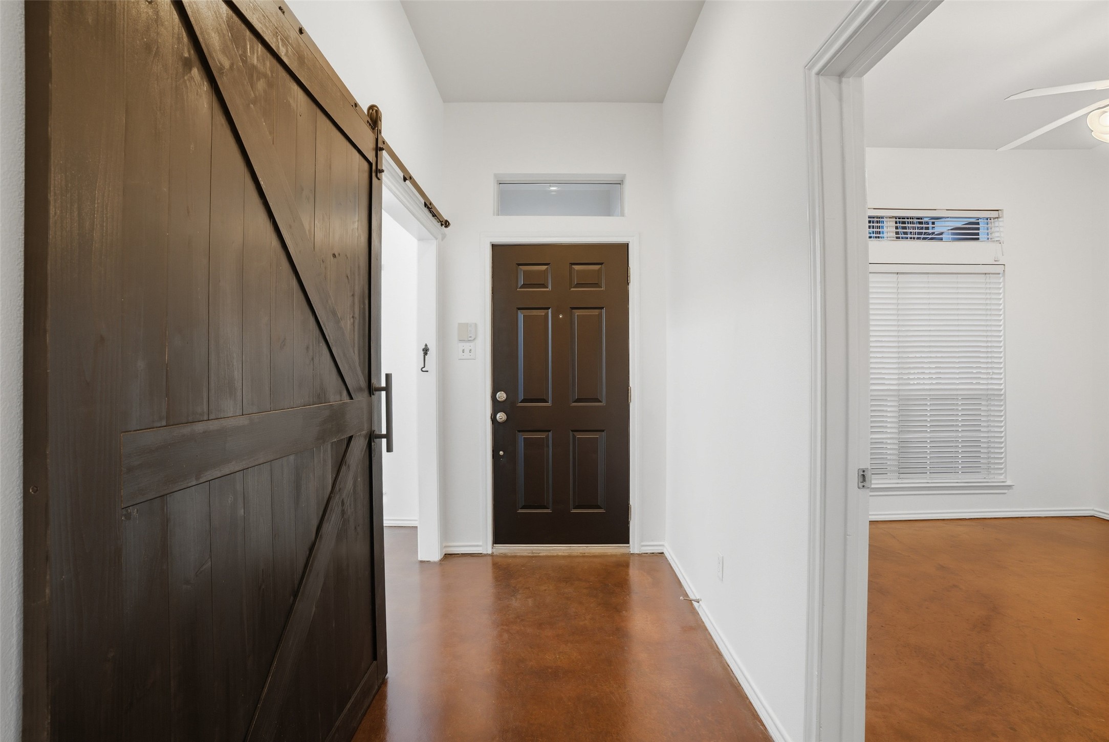 2918 Ranch To Market Road 620, Unit V267 Austin, TX 78734 - Photo 9 of 40 a view of a hallway with wooden floor and entryway