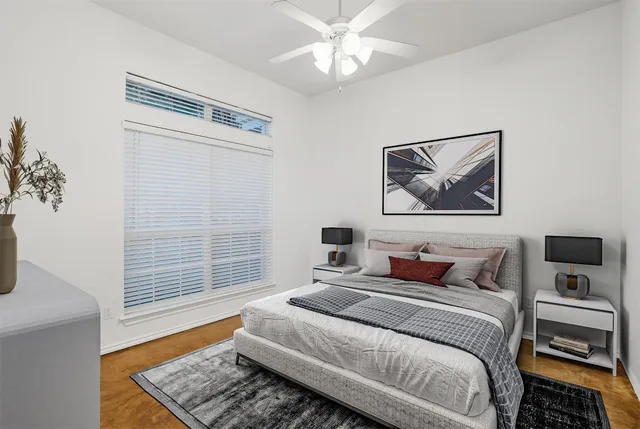 a bedroom with a bed and a window