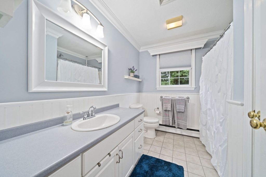 36 Meadow Lane Hanson, MA 02341 - Photo 17 of 36 a bathroom with a granite countertop sink mirror and a bathtub