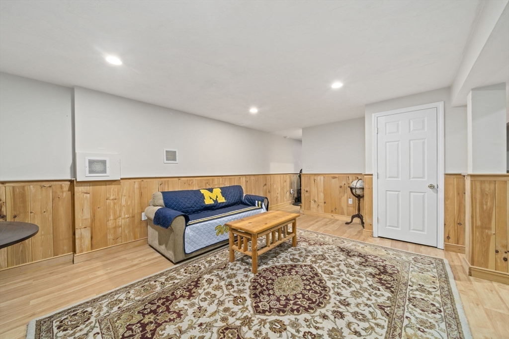 36 Meadow Lane Hanson, MA 02341 - Photo 19 of 36 a living room with a couch and a rug