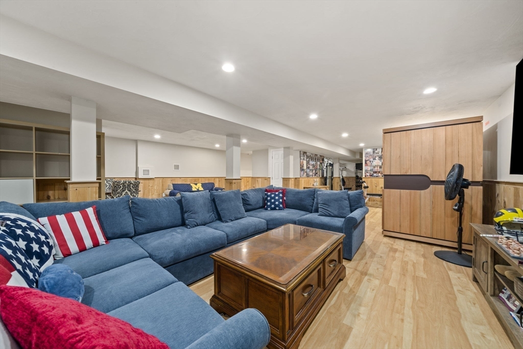 36 Meadow Lane Hanson, MA 02341 - Photo 20 of 36 a living room with furniture and a flat screen tv