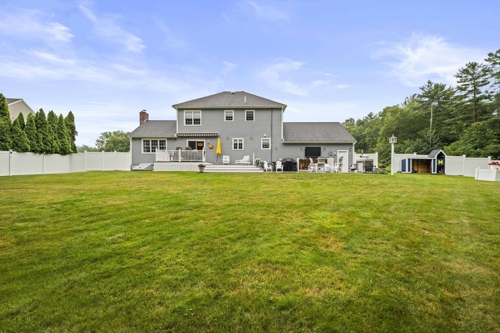 36 Meadow Lane Hanson, MA 02341 - Photo 26 of 36 a big white house with a big yard and large trees