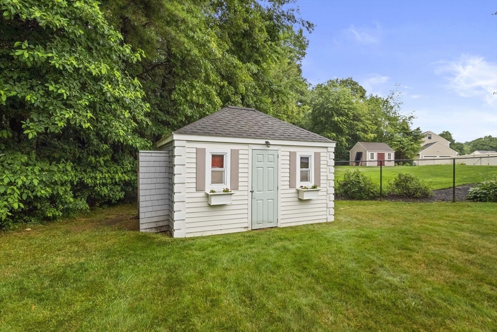 36 Meadow Lane Hanson, MA 02341 - Photo 27 of 36 a front view of a house with a garden