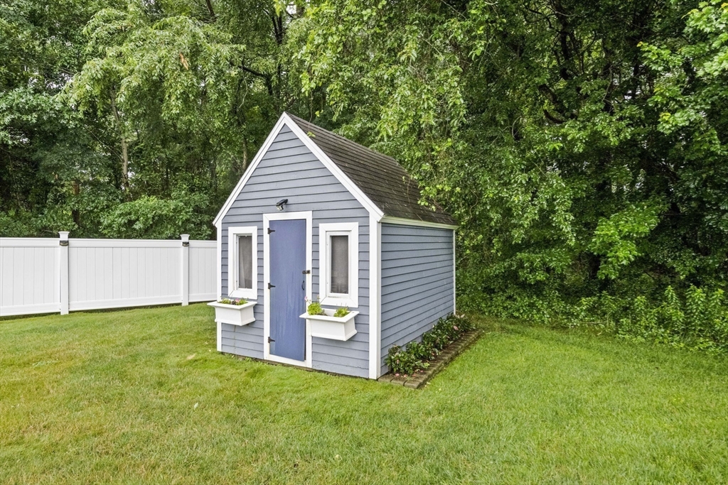 36 Meadow Lane Hanson, MA 02341 - Photo 28 of 36 a view of an house with backyard space and garden