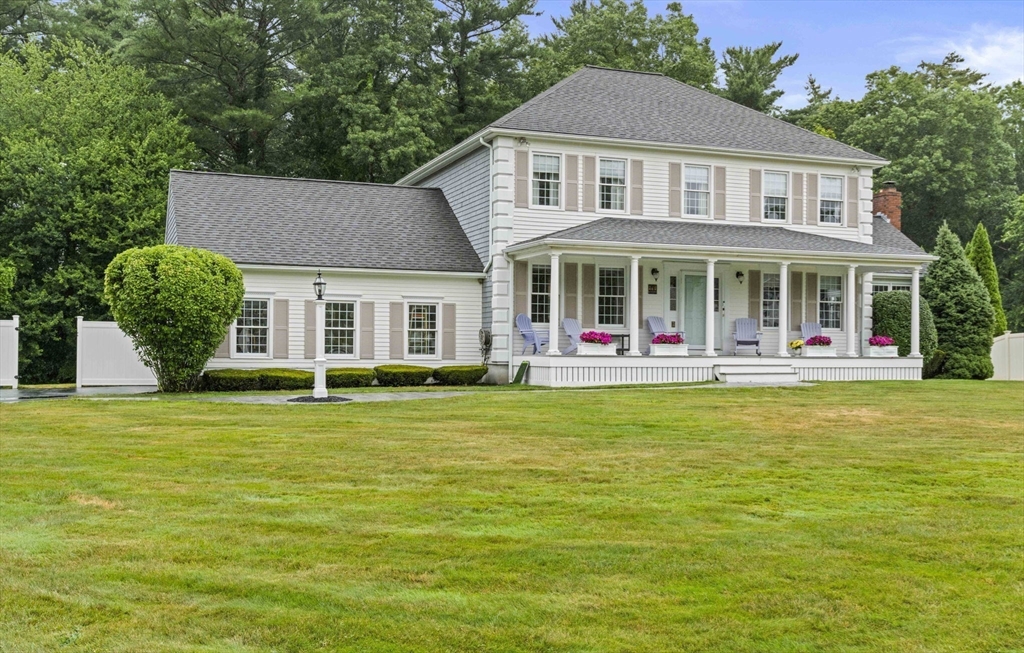 36 Meadow Lane Hanson, MA 02341 - Photo 32 of 36 a front view of a house with a garden and lake view