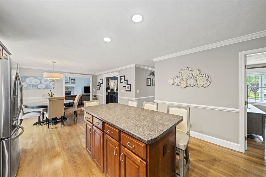 36 Meadow Lane Hanson, MA 02341 - Photo 4 of 36 a living room with dining table and wooden floor