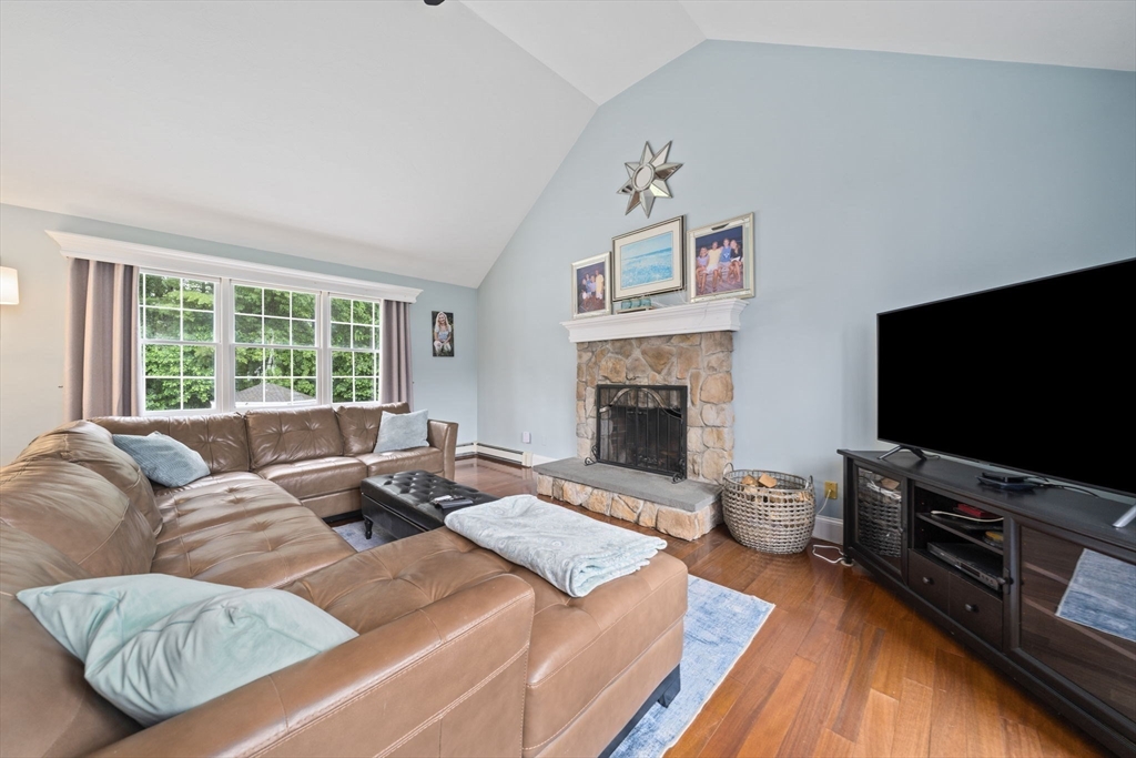 36 Meadow Lane Hanson, MA 02341 - Photo 7 of 36 a living room with furniture flat screen tv and a fireplace