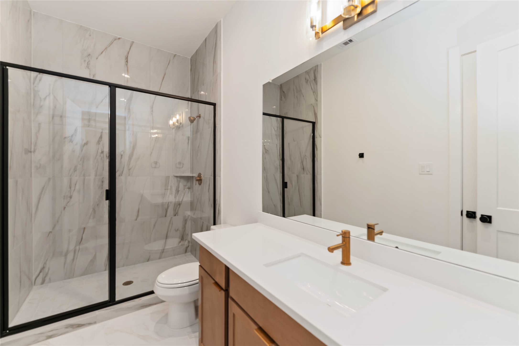 613 Wendel Street Houston, TX 77009 - Photo 31 of 32 a bathroom with a sink toilet and shower