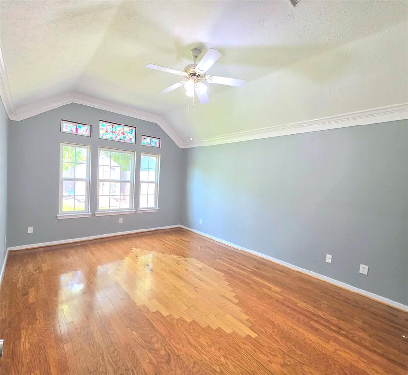 13618 Sablegrove Lane Houston, TX 77014 - Photo 13 of 30 wooden floor in an empty room with a window