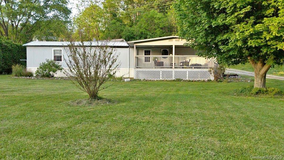 756 Hyder Mountain Road Clyde, NC 28721 - Photo 1 of 1 a front view of a house with garden