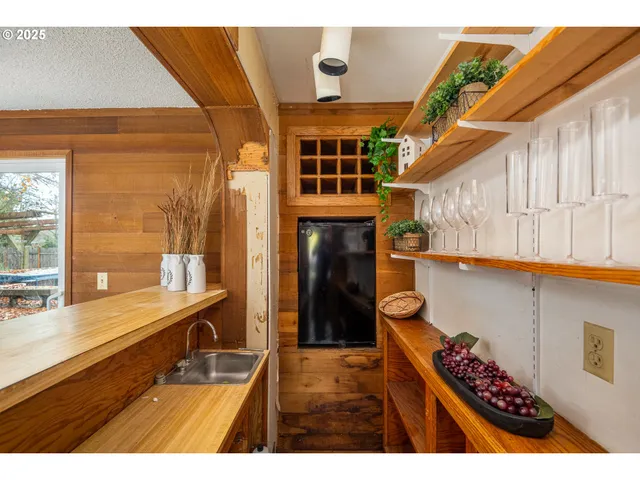 a view of kitchen with furniture and a potted plant