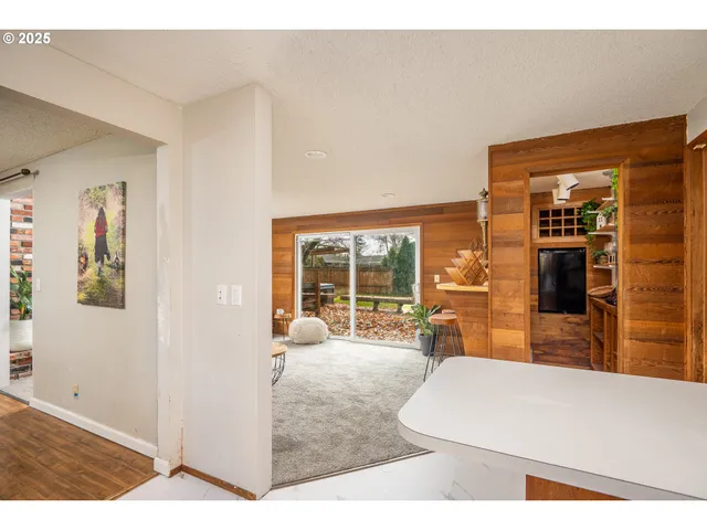a living room with furniture and large windows