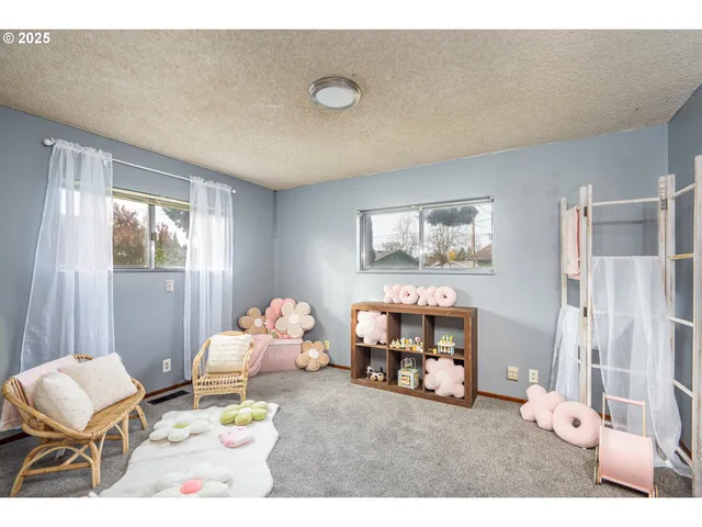 a living room with furniture and a table