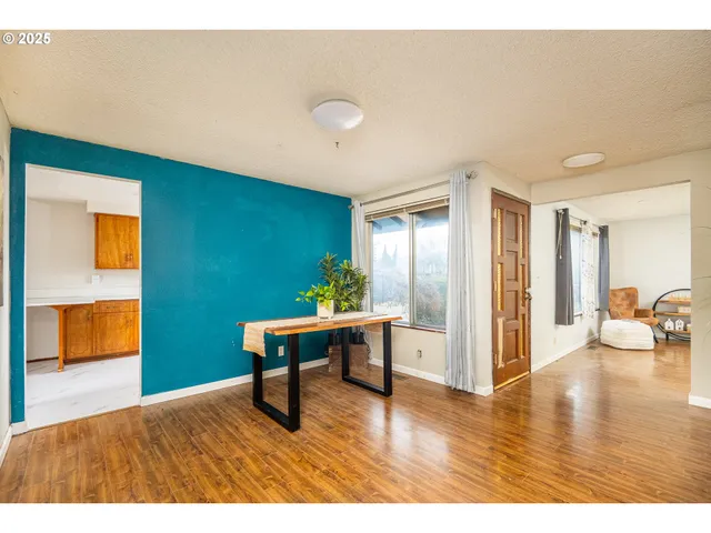 a view of a livingroom with furniture and wooden floor