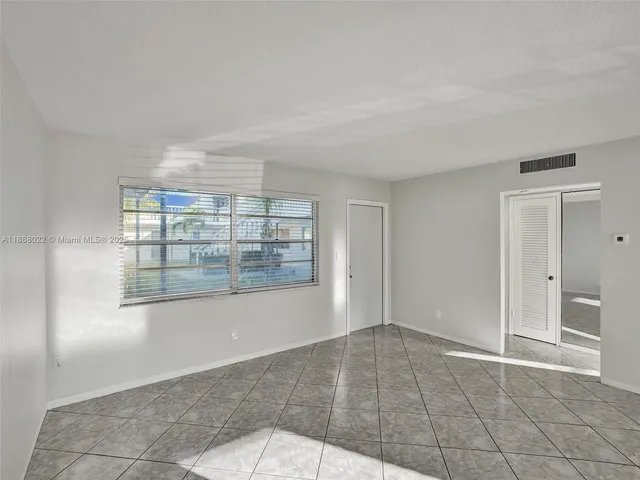 a open kitchen with cabinets and stainless steel appliances