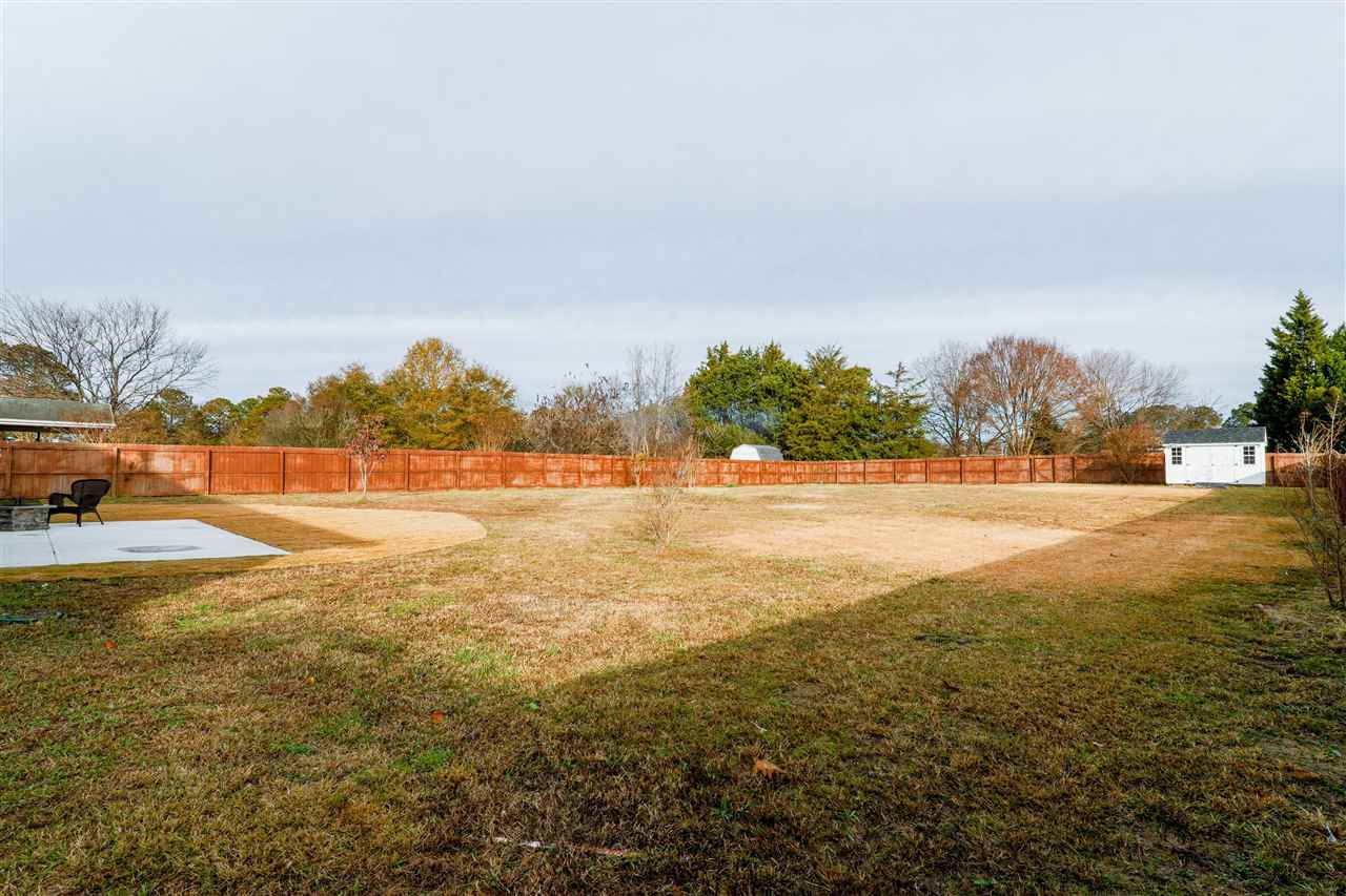 113 Weathers Street Rolesville, NC 27571 - Photo 24 of 25 Fenced yard with storage shed