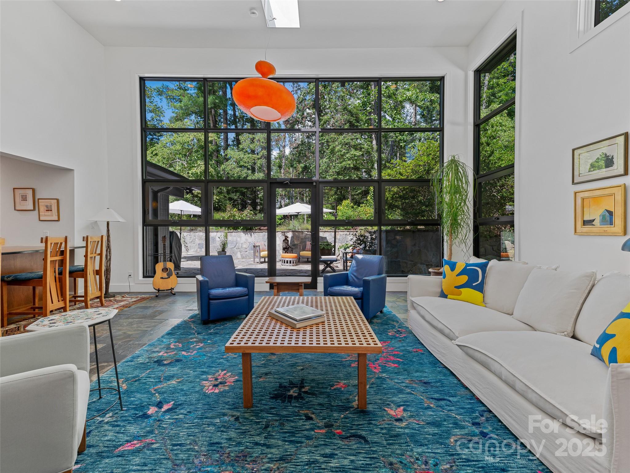 5 Brookside Road Asheville, NC 28803 - Photo 11 of 45 a living room filled with furniture and a floor to ceiling window