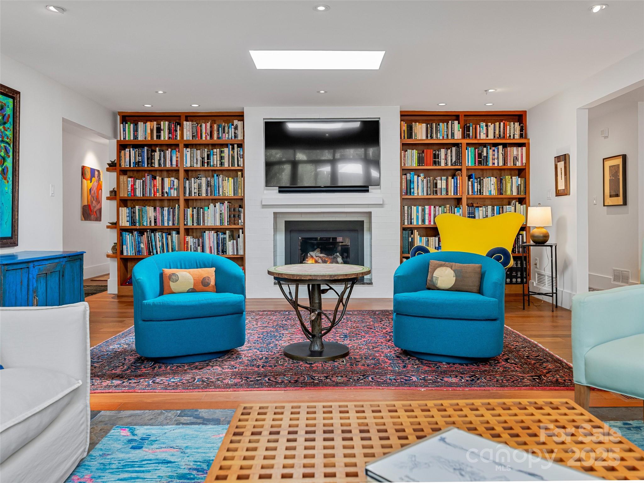 5 Brookside Road Asheville, NC 28803 - Photo 15 of 45 a living room with furniture and a fireplace