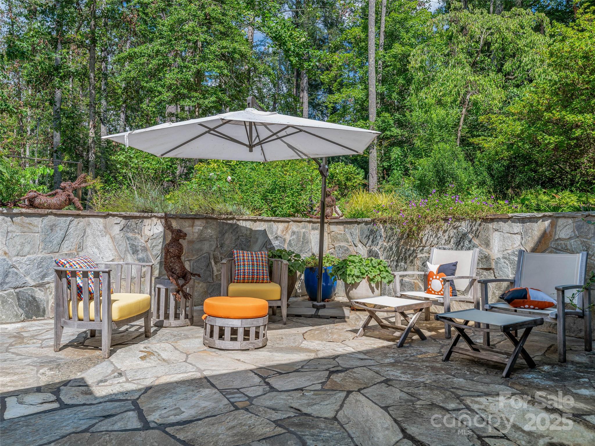5 Brookside Road Asheville, NC 28803 - Photo 18 of 45 a backyard of a house with table and chairs