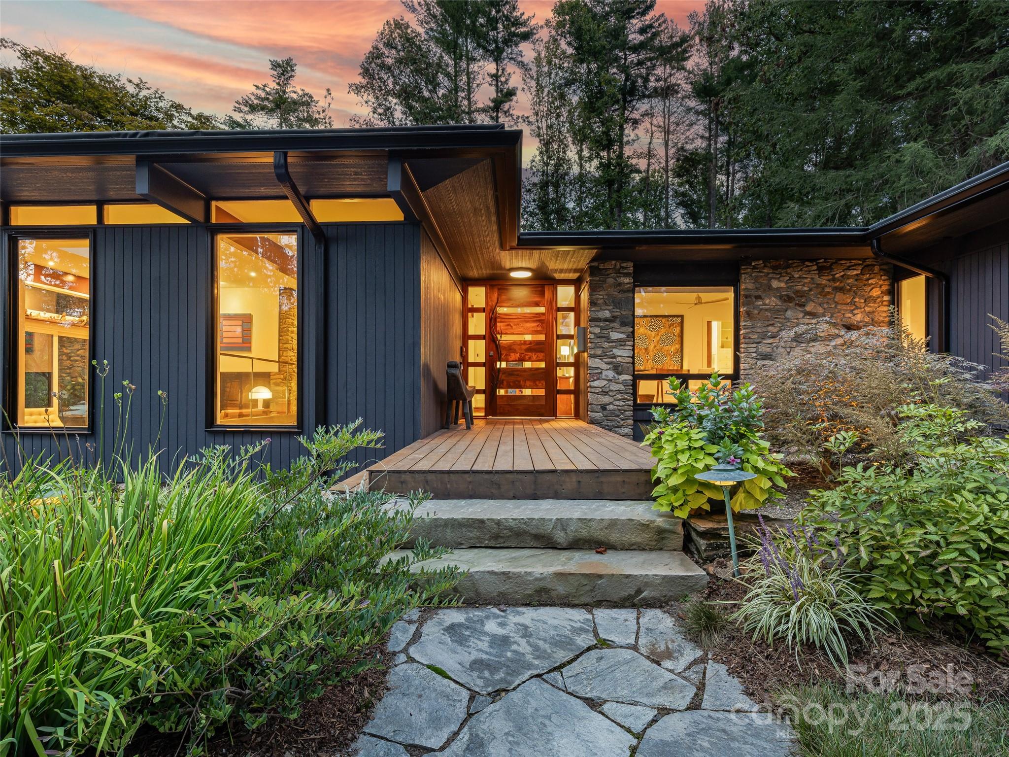 5 Brookside Road Asheville, NC 28803 - Photo 2 of 45 a front view of a house with garden