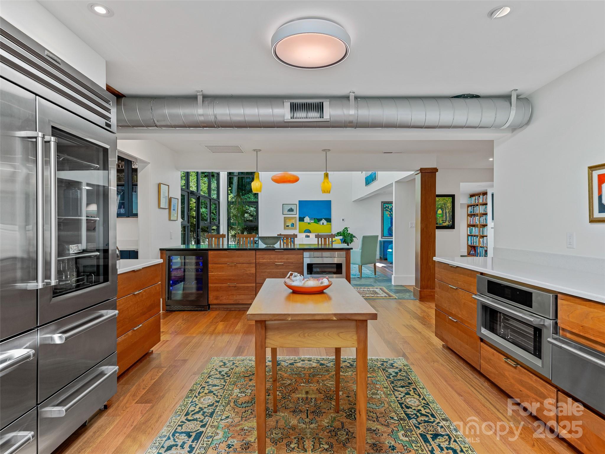 5 Brookside Road Asheville, NC 28803 - Photo 24 of 45 a dining hall with stainless steel appliances kitchen island granite countertop a table and chairs