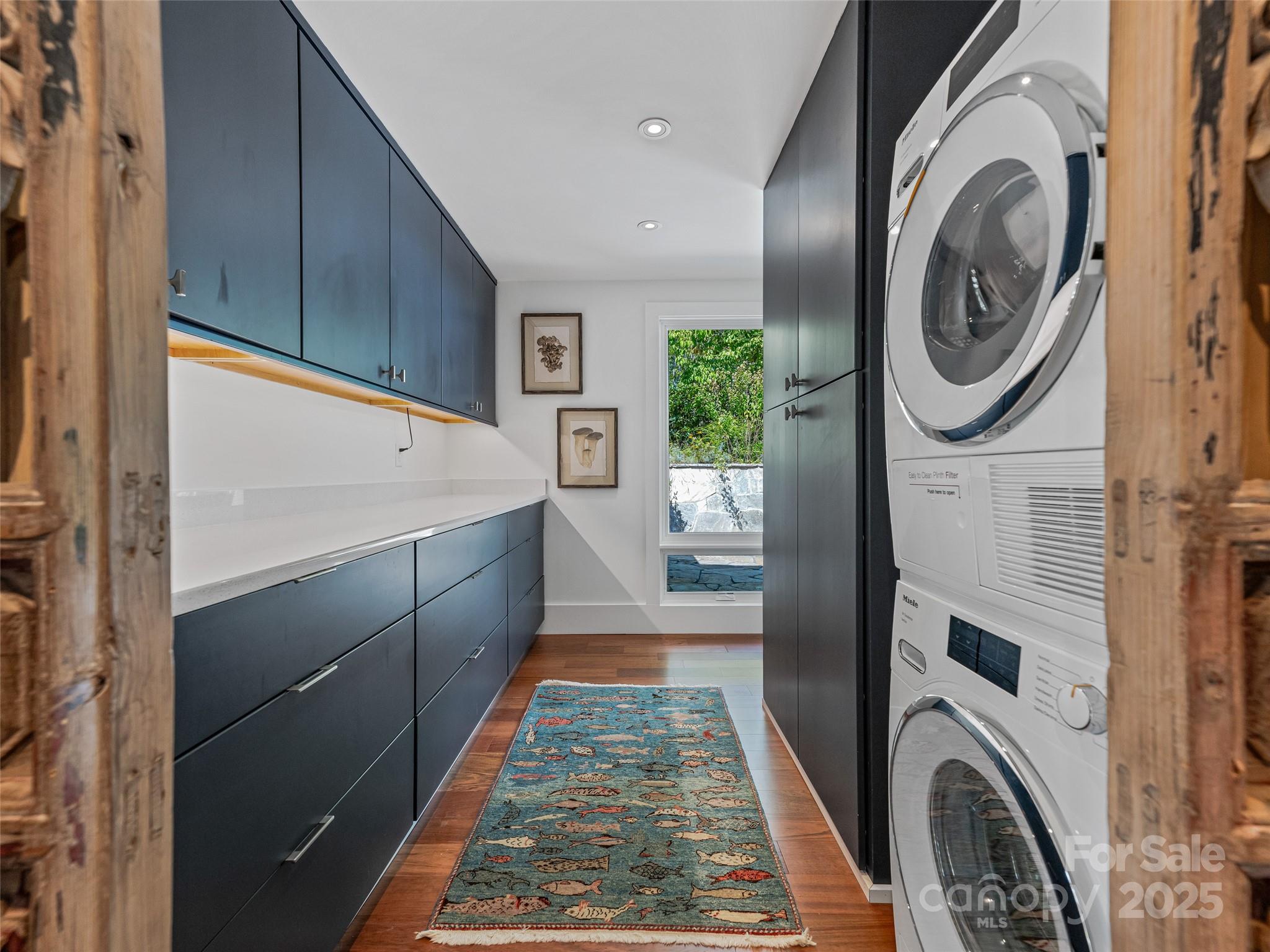 5 Brookside Road Asheville, NC 28803 - Photo 29 of 45 a bathroom with a sink a washer and dryer