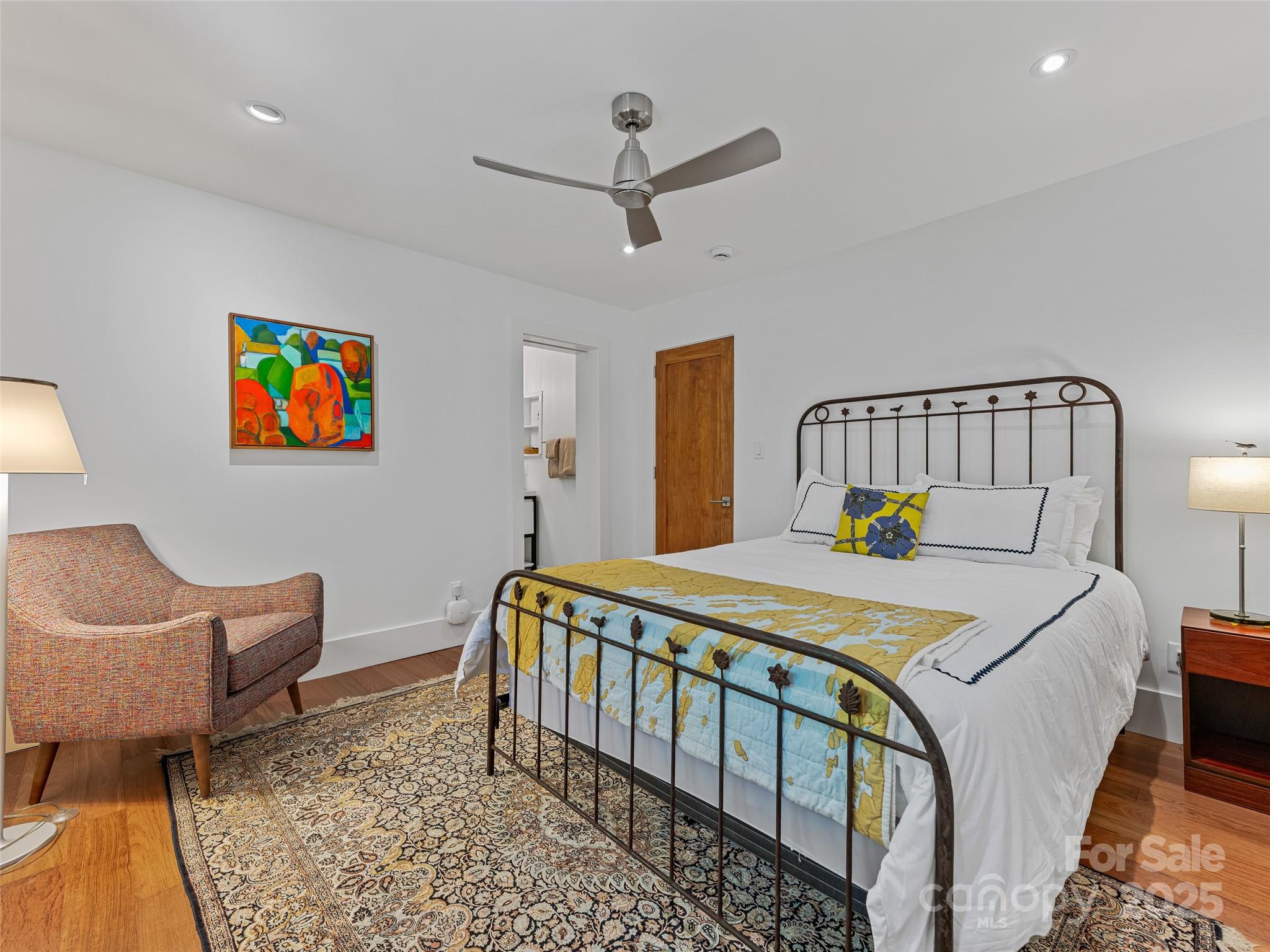 5 Brookside Road Asheville, NC 28803 - Photo 36 of 45 a bed room with a bed and a chair