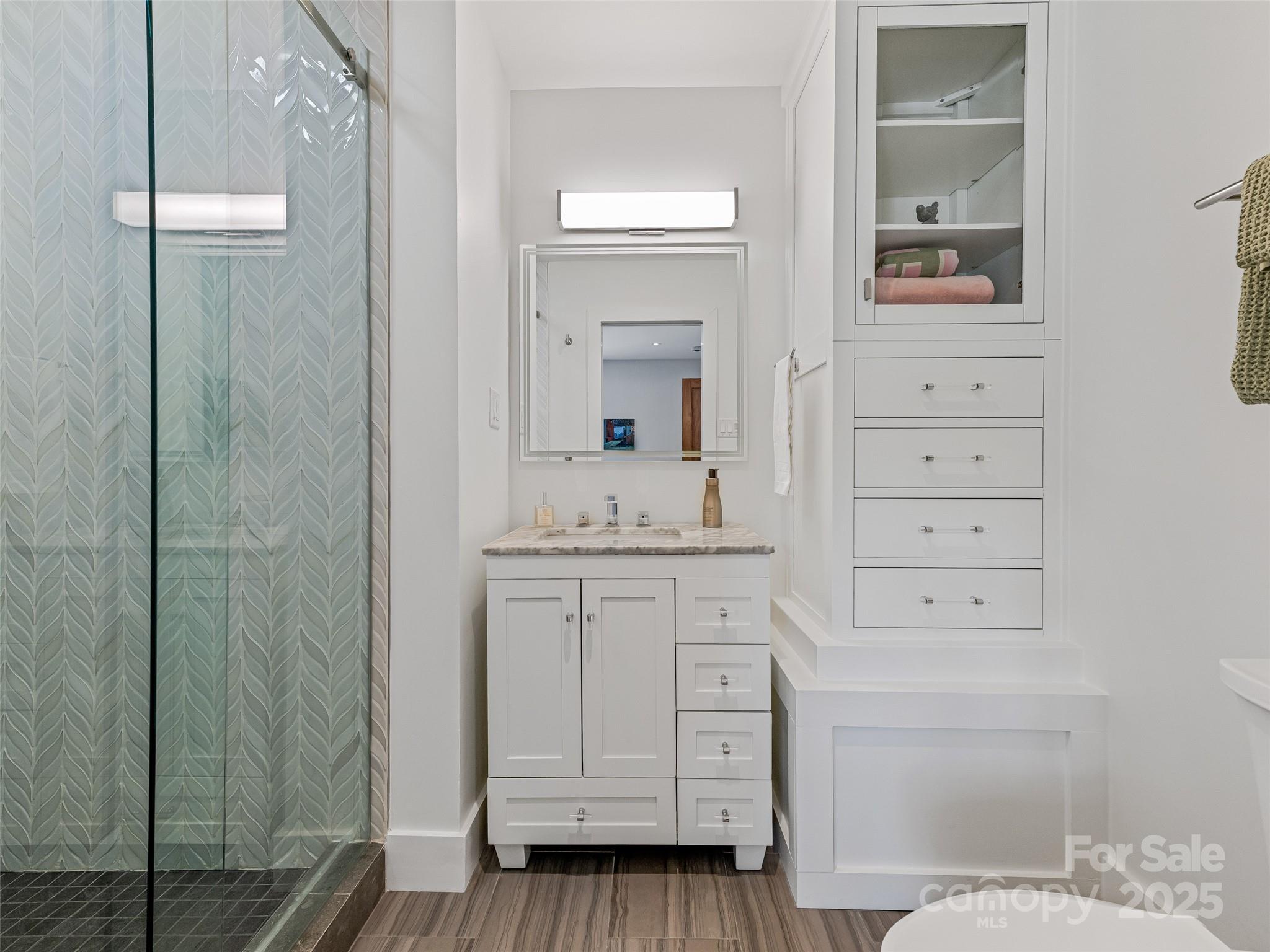 5 Brookside Road Asheville, NC 28803 - Photo 40 of 45 a bathroom with a sink a vanity and a mirror