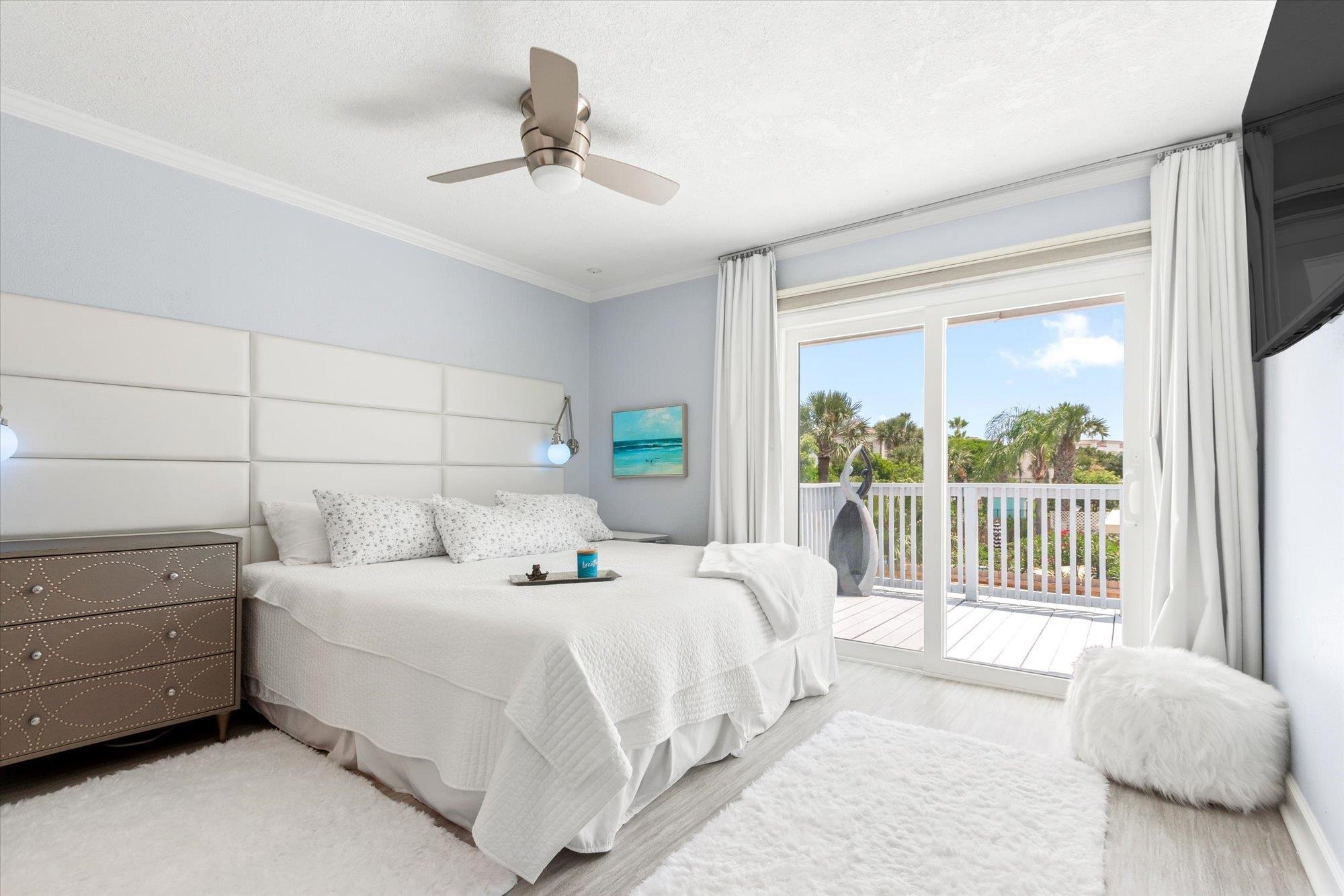 78 Ferrol Road St. Augustine, FL 32084 - Photo 18 of 59 a bedroom with a bed and a large window