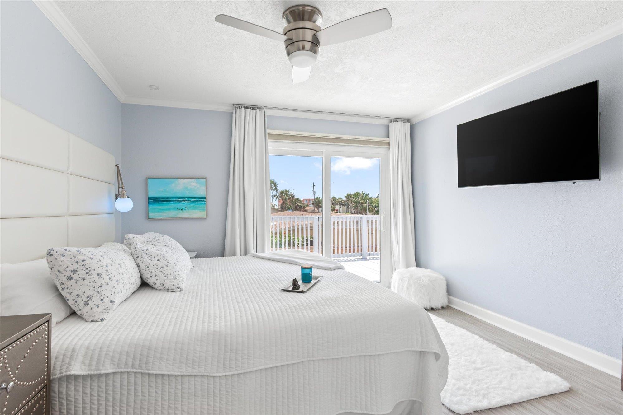 78 Ferrol Road St. Augustine, FL 32084 - Photo 19 of 59 a bedroom with a large bed and a flat screen tv