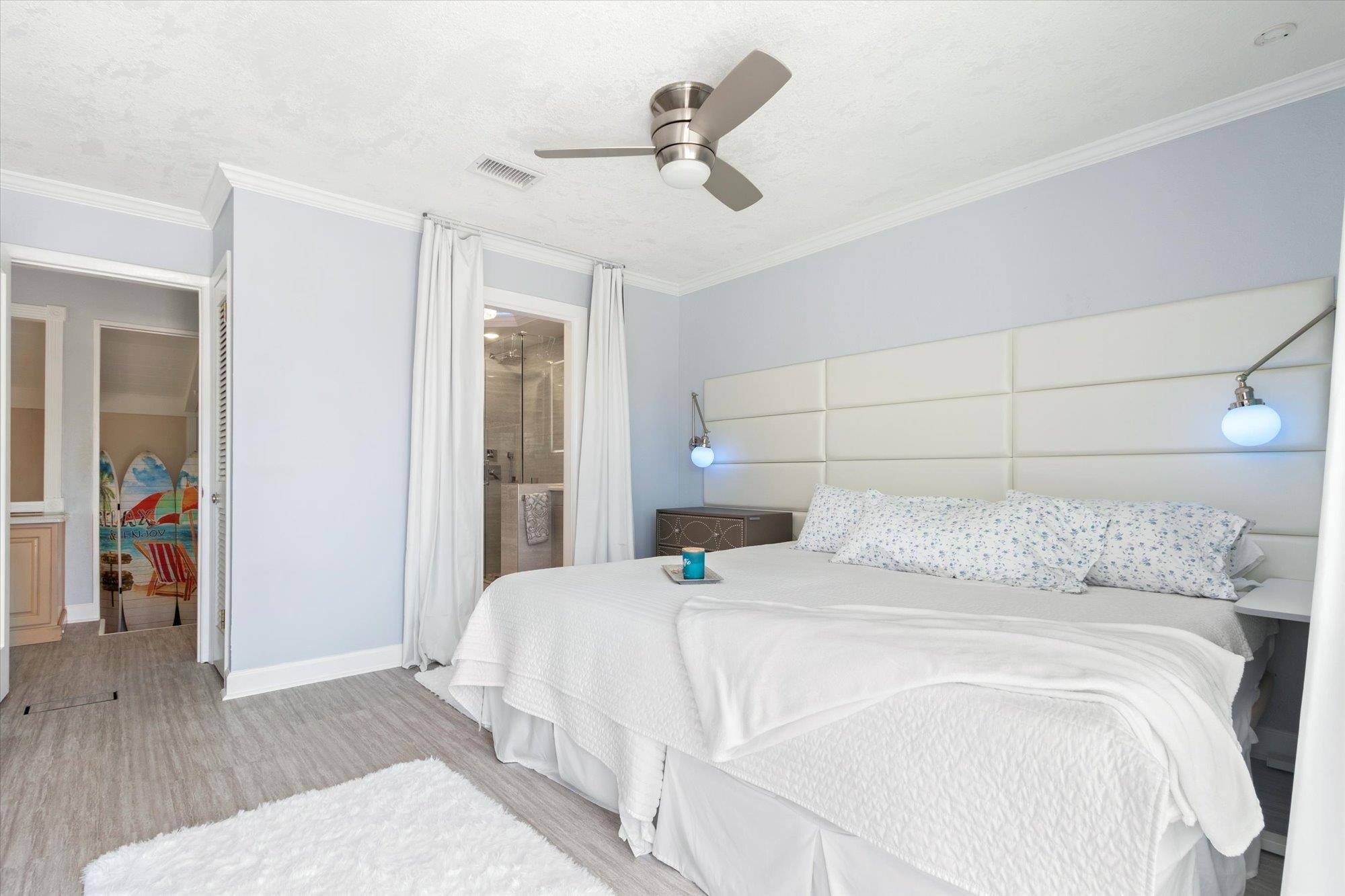 78 Ferrol Road St. Augustine, FL 32084 - Photo 20 of 59 a bedroom with a bed and a chandelier